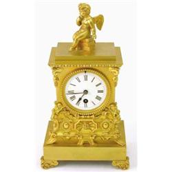 A 19th century French ormolu mantel timepiece, with architectural case and cupid finial, 13.5ins...
