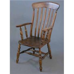 A Victorian oak, ash and elm Windsor elbow chair, on turned legs...