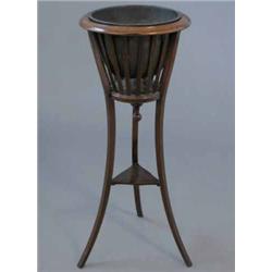 An Edwardian beech jardiniere, with brass liner, slatted sides and outswept squared legs...
