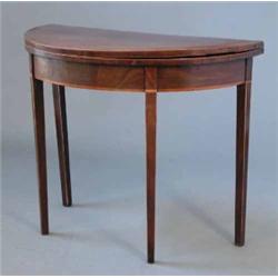 An early 19th century inlaid mahogany demi lune card table, on square tapered legs, 2ft 10ins...