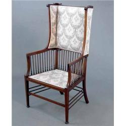 An Edwardian inlaid mahogany high back occasional elbow chair, with spindle rail on square tapere...
