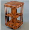 Image 1 : A reproduction burr walnut and oak revolving bookcase, 1ft 6ins...