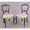 Image 1 : A set of four Victorian walnut dining chairs, with carved spoon shape backs on cabriole legs...