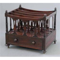A Victorian mahogany four division canterbury, with base drawer on disc feet, 1ft 8ins...