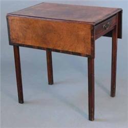 A George III mahogany and crossbanded Pembroke table, with single drawer on fluted chamfered legs...