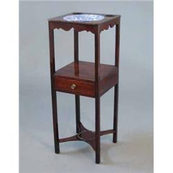 An early 19th century mahogany washstand, with later Copeland Spode Italian bowl, over a drawer o...