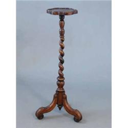 A late 19th century walnut candle stand, with barley twist column and scroll tripod, Height 3ft 5...