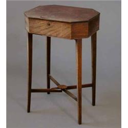 A George III mahogany work table, with octagonal top on square tapered legs with cross stretcher,...