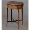 Image 1 : A George III mahogany work table, with octagonal top on square tapered legs with cross stretcher,...