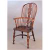 Image 1 : An early 19th century yew Windsor hoop back elbow chair, with pierced splat, elm seat and turned...