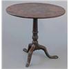 Image 1 : A George III mahogany circular occasional table, on tapered and spiral fluted stem and damaged tr...