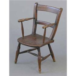 A Victorian oak child's chair, on turned legs...