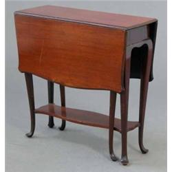 An Edwardian mahogany Sutherland table, with shaped flaps and understage on cabriole legs 2ft...