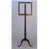 Image 1 : An early 19th century mahogany music stand, on turned stem and tripod...