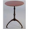 Image 1 : A George III mahogany circular occasional table, on turned stem and three curved legs with inlaid...