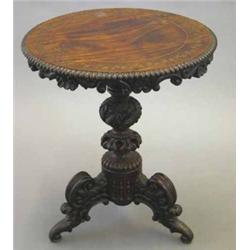 A 19th century Anglo Indian mahogany circular occasional table, with brass inlaid ivy margin and...