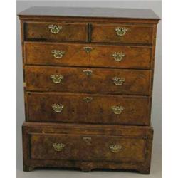 An early 18th century walnut chest, of two short and four long drawers on bracket feet, 3ft 1ins...