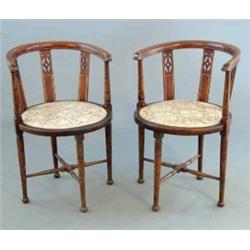 A pair of Edwardian inlaid beech tub chairs, on turned tapered legs...