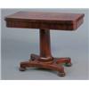 Image 1 : A Victorian mahogany card table, with rounded rectangular top on octagonal stem, platform and bun...