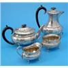 Image 1 : A George VI four piece silver tea set, of facetted oval form comprising tea and hot water pots, c...
