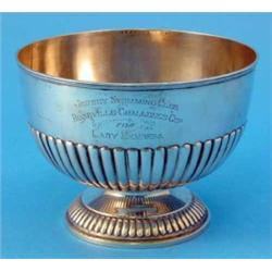 An Edwardian silver rose bowl, with banded rim and demi-fluted decoration, maker Goldsmiths & Sil...