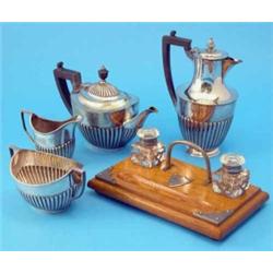 A 3-piece plated teaset, a similar coffee pot and a plate mounted golden oak desk stand...