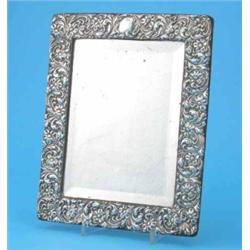 A Victorian silver mounted wall mirror, decorated throughout with a scrolling floral design, Birm...