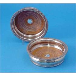 A pair of plated wine coasters, with gadrooned rims, 6.25ins...