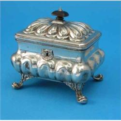 A mid-19th century Austrian white metal casket, with wooden finial, gadrooned lid and fluted balu...