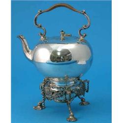 A plated kettle on stand, with caned scroll handle and foliate cast tripod base, 12ins...