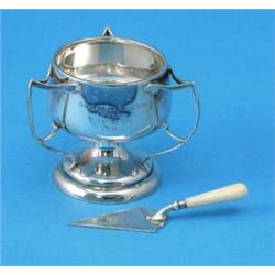 A George V silver miniature trophy cup, with 3 stylised scroll handles, on swept circular base, B...