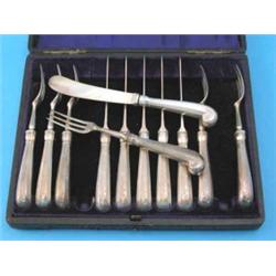An Edwardian cased set of 6 pairs of silver pistol grip dessert knives and forks, maker Francis H...