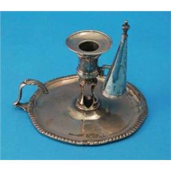 A George III silver chamberstick, with gadrooned rim and flying scroll handle, maker John Carter...