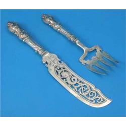 A pair of Victorian pierced silver fish servers, decorated throughout with foliate motifs and scr...