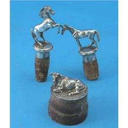 Two Continental novelty silver stoppers modelled as horses, import mark for London 1963 and a mod...