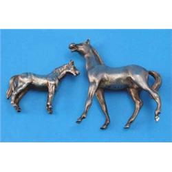 A modern silver model of a horse, London 1971 and a smaller white metal horse model, 3.5 x 2.5ins...