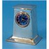 Image 1 : A Liberty & Co. hammered silver mantel timepiece, of plain swept rectangular form with blue/green...