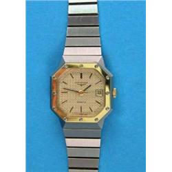 A lady's steel Longines quartz wrist watch, with gilt bezel and date aperture...