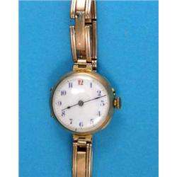 A lady's 15ct gold wrist watch, with enamelled dial and expanding bracelet...
