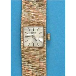 A lady's 9ct 3-colour gold Marvin Revue wrist watch, with integral textured bracelet...