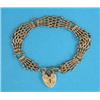 Image 1 : A 9ct gold fancy gate link bracelet, with engraved padlock clasp, 21grms...
