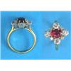 Image 1 : An 18ct gold cluster ring, claw-set with an oval synthetic ruby bordered by 8 brilliant cut diamo...