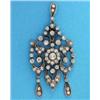 Image 1 : A late Victorian diamond pendant, of openwork scroll and flowerhead design, millegrain set with o...