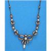 Image 1 : An Edwardian diamond and pearl necklace, the centre front designed as a tied ribbon supporting a...