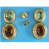 Image 1 : A pair of 18k gold earrings, each with an oval peridot and a citrine in rub-over settings, stampe...