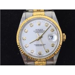 Gent's Rolesoryellow gold Rolex Oyster Perpetual Swiss Made Watch. 18 Karat Gold Bezel with 10 Diamo