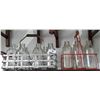 Image 1 : TWO VINTAGE MILK BOTTLE CARRIERS W/BOTTLES