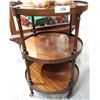 Image 1 : THREE TIER ROUND MAHOGANY OCCASIONAL TABLE ON CASTERS