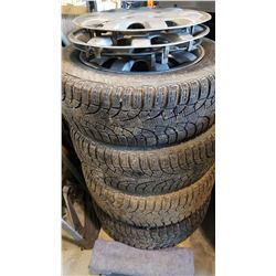 SET OF FOUR PIRELLI 15" TIRES ON 4 BOLT RIMS