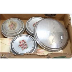 FLAT OF VINTAGE MUSTANG GT AND BUICK HUBCAPS